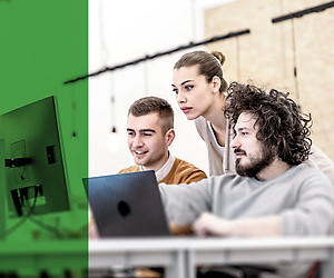 A group of students collaborating around a computer